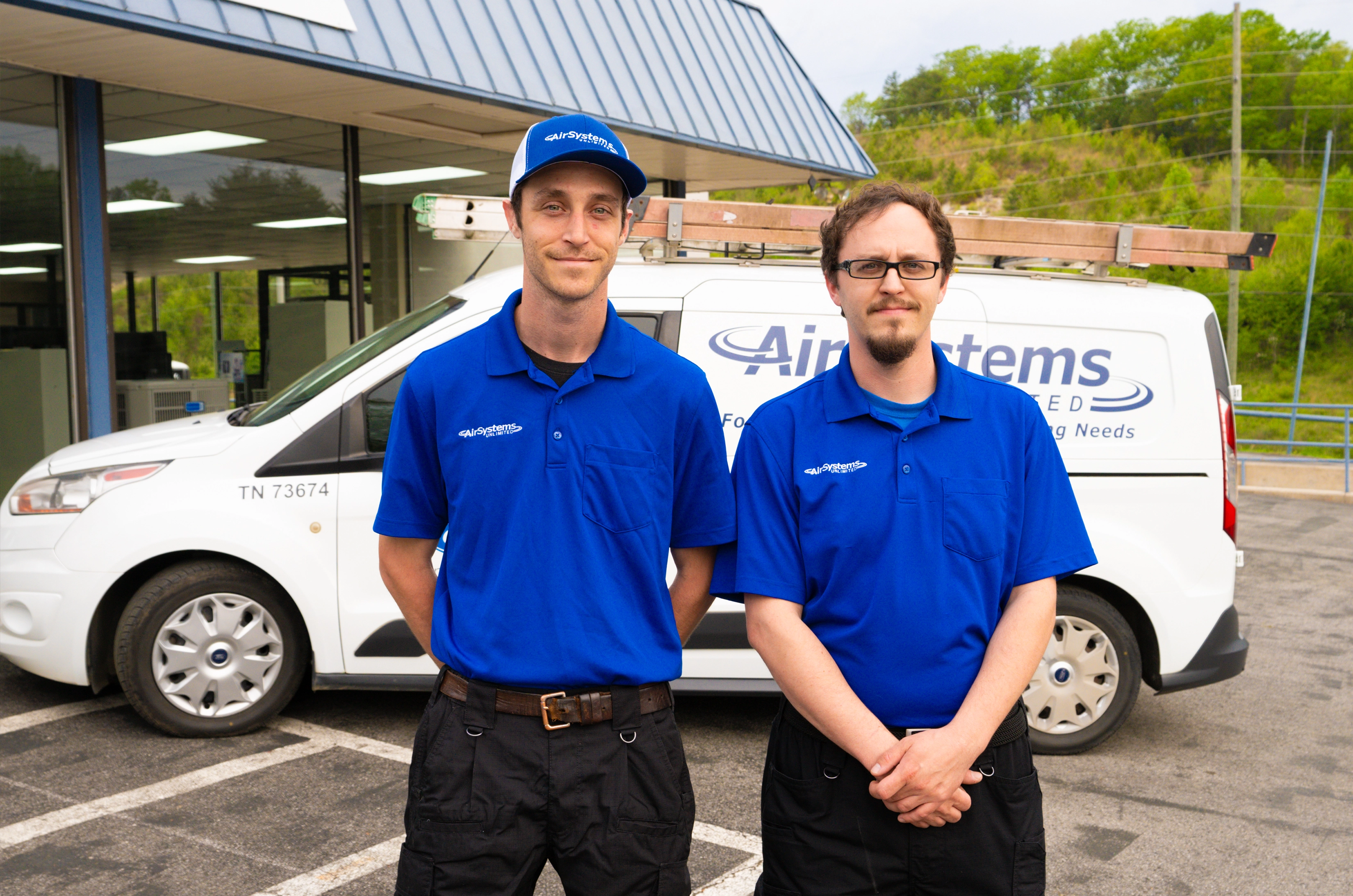 Mechanics stand with the AirSystems Unlimited van